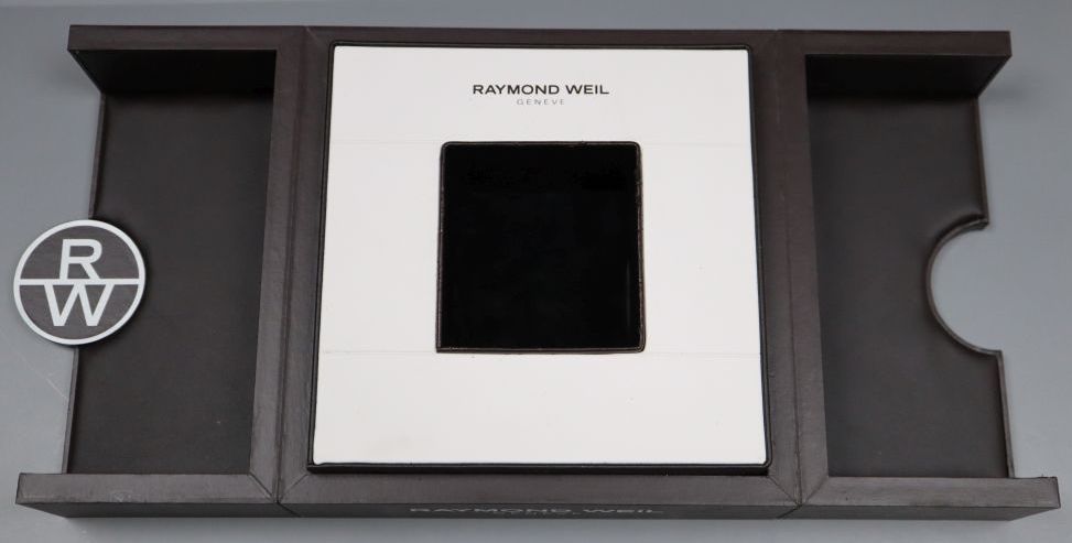 A gentlemans modern stainless steel Raymond Weil automatic wrist watch, with original box.